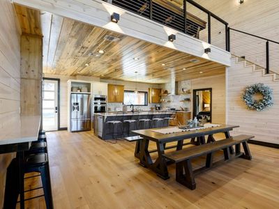 The formal dining table and bar top seating