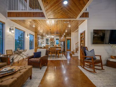 The living room seamlessly transitions into the dining area fand kitchen.