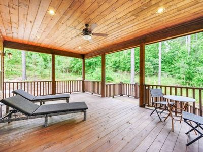 Access from the Master, lounging chairs on the covered patio.