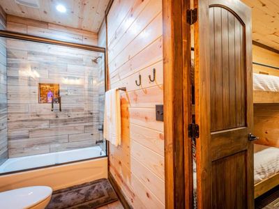 Shared full bathroom between bunk room and game room.