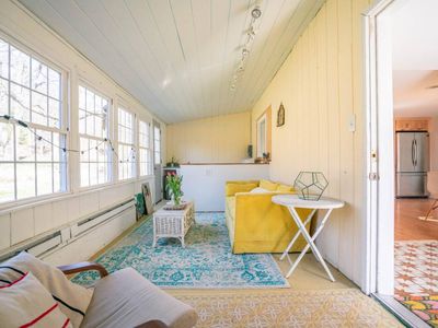 Through the door to the left of the entryway is the four seasons room