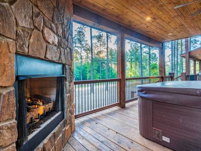 Next to the 8-person hot tub is another gas fireplace.