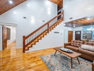 The stairs lead to 2 King Suites!