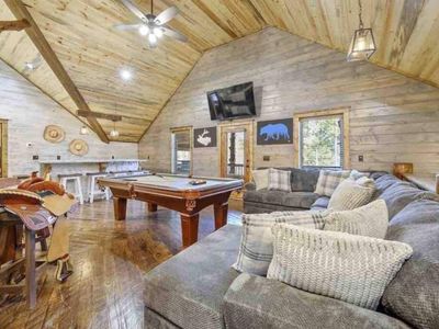 Oversized sectional for guests to relax or wait their turn to play some pool!