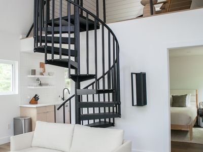 Spiral staircase infront of the first floor bedroom.