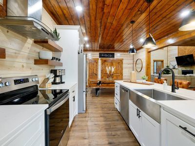 2 ovens, a dishwasher, ample amounts of counter space and an oversized sink!