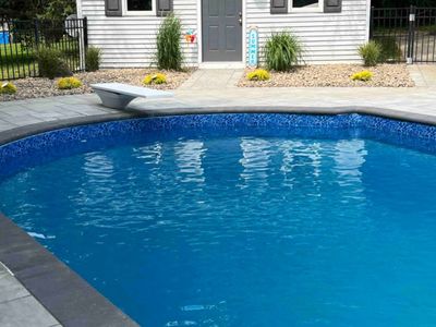 Surrounding trees make for the perfect place to soak. Please note: diving board no longer available.