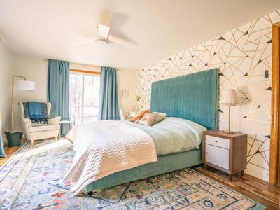 Beautiful primary bedroom with king bed and en suite bathroom.