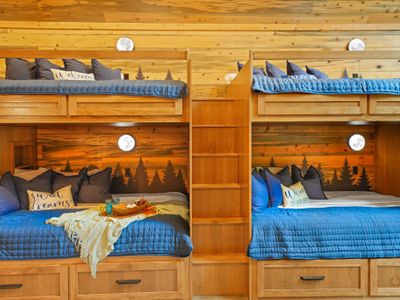 Climb into comfort with warm wood, soft lighting, and nature-inspired art tucked into every nook.