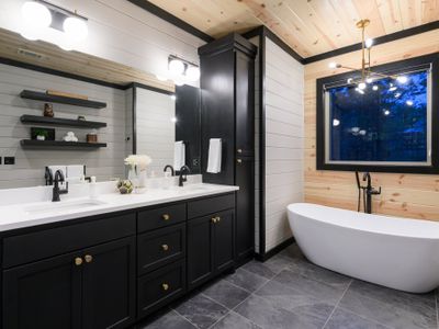 This Master bathroom also has a luxury soaking tub.