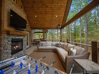 The covered outdoor patio with games and lounging.