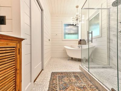 Soaking tub and double head walk-in shower.