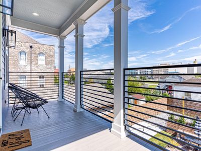 Covered balcony with view of downtown, the Superdome, and neighboring historic buildings!
