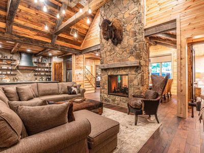 The fireplace separates the lodge room from the formal dining room.