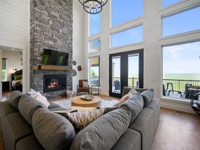 An oversized sectional around the floor to ceiling gas fireplace!