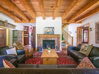 Main floor living area with fireplace and small library