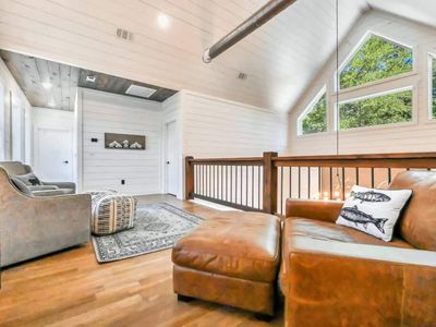 The upstairs lounge room where you can overlook the living area.