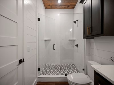 The attached bathroom with a walk-in shower.