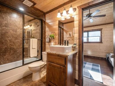 Shared bathroom with tub/shower.