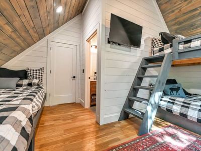 A second bunk room is on the top floor and has 2 full beds and 2 twin beds.