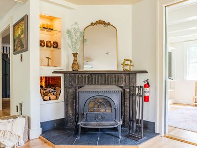 Snuggle up next to this classic wood stove, brimming with country charm.