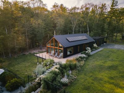 View of the main house, carport, and deck