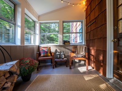 The sunroom is the perfect place to gather with loved ones or enjoy a cup of coffee in the morning!