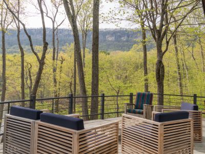 Back on the main level, step out onto the deck to marvel at the surrounding ridge and lake below.