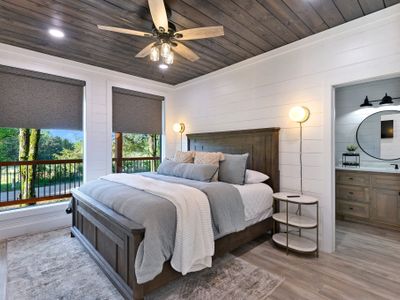 The first Master Suite features a king bed and an attached bathroom!