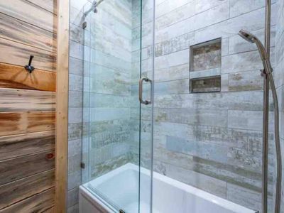 The bunk bathroom has a shower/tub combo.