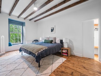 Cluttered mind? Leave it at the door. This sleek bedroom is the perfect place to refocus and refresh.