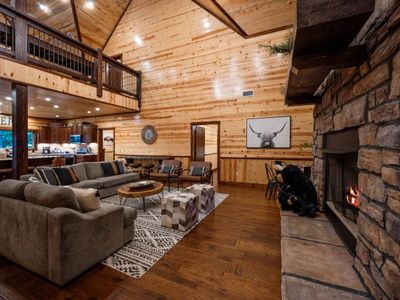 From the living room you can easily socialize with those in the kitchen.