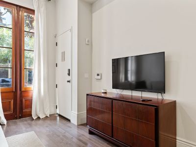 Living room equipped with TV perfect for viewing Netflix