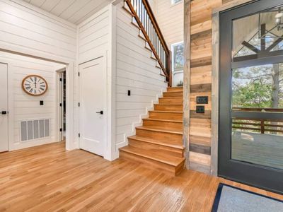 Ascending to the second floor are 4 additional bedrooms.