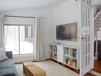 Picture frame tv and plenty of books in the second living room