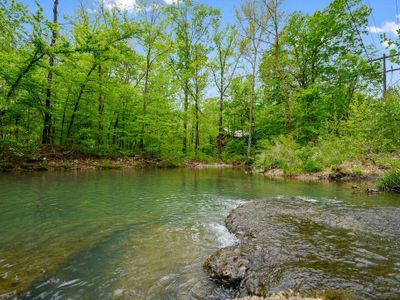 Flowing creek just steps away from the property! Bring your fishing poles!