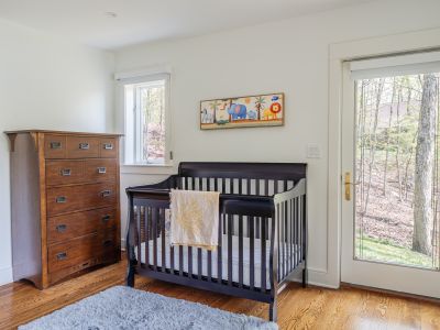 The queen bedroom on the lower level also features an in-room crib, perfect for those traveling with little ones.