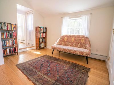 Around the corner is our small library, perfect for curling up with a good book