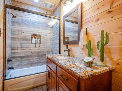 Private bathroom with tub/shower combo.