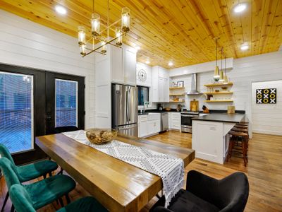 The living room seamlessly flows into the kitchen/dining area.