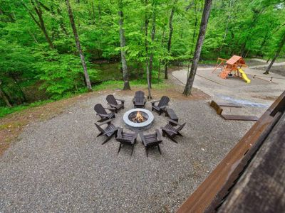 The firepit is found in the back yard and has Adirondack chairs!