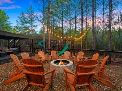 The fire pit with Adirondack chairs is a perfect place to take in the night air!