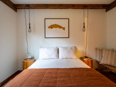 The fishing bedroom features artwork from local artist Steven Weinberg.