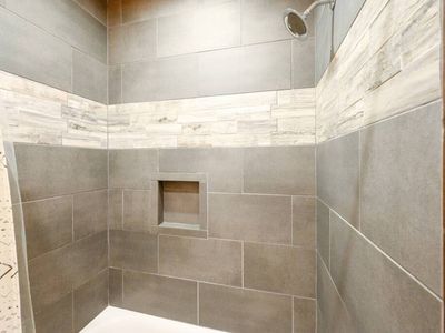 Walk in shower in Full Bathroom attached to King Bedroom 2.