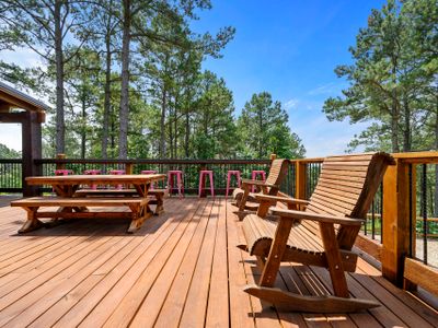 Rocking chairs, picnic tables and bar tops can all be found on the patio!