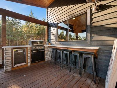The gas grill and additional outdoor seating!
