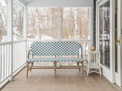On the screened in porch of the guest house.