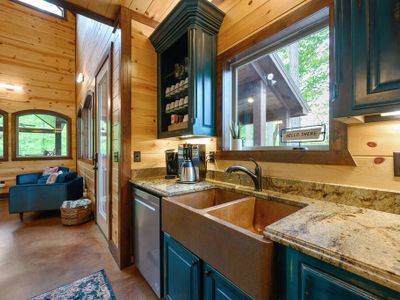 The kitchen is equipped with updated appliances and views to the back yard!
