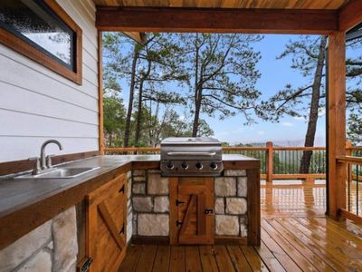 The gas grill, propane provided plus a sink and ample counter space!