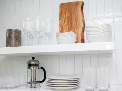 Dishware and glassware located in the kitchen.